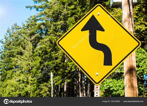 Yellow Road Sign Warning Dangerous Curves Ahead Winding Forest Road