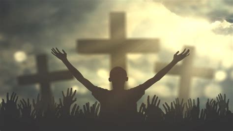 7 15 Bo Silhouette Of Hands Raised In Praise To Glittering Crosses