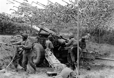 Artillerymen Of The 333rd Field Artillery Battalion Emplace Their 155