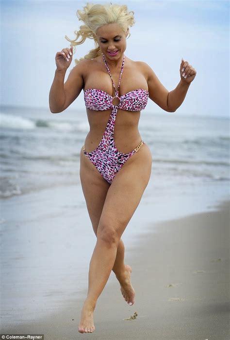 Coco S Dangerous Curves Threaten To Spill Out Of Her Flimsy Swimsuit As She Jogs Along The Beach