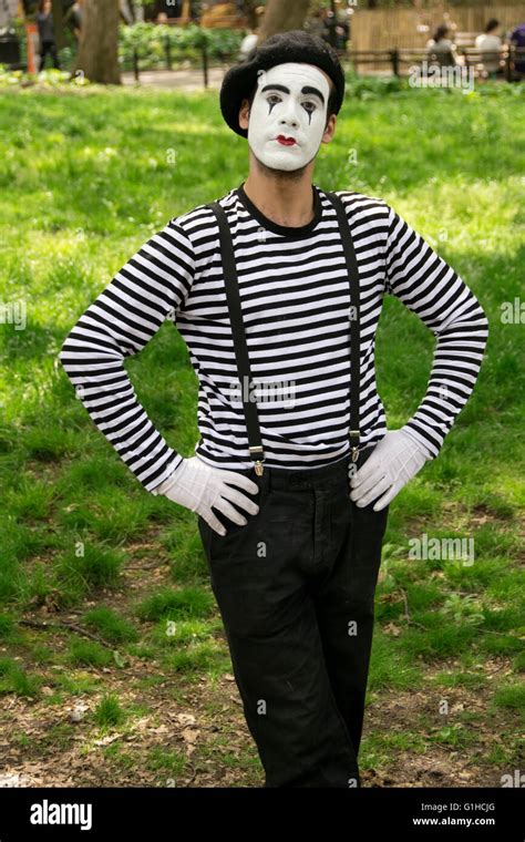 Portrait Of A Mime In A Traditional Mimes Outfit Poses For A Portrait