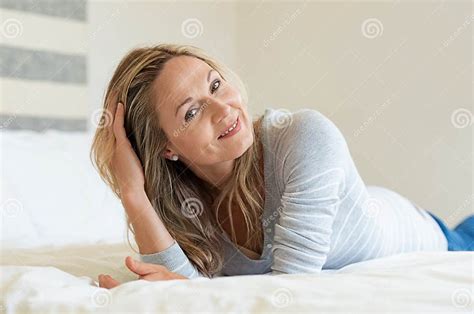 relaxed mature woman on bed stock image image of attractive woman 125353685