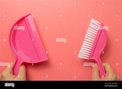 Pink Broom And Dustpan Isolated On Pink Background Top View Stock