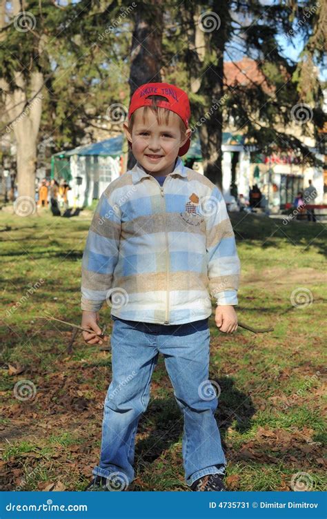 Little Boy With Red Hat Stock Image Image Of Contented 4735731