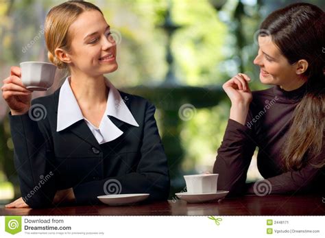 Two businesswomen chatting stock image. Image of outdoor - 2448171