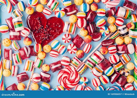 High Angle Shot Of Colorful Candies And A Heart Shaped Lollipop