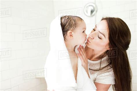 Mother Kissing Son In Bathroom Stock Photo Dissolve