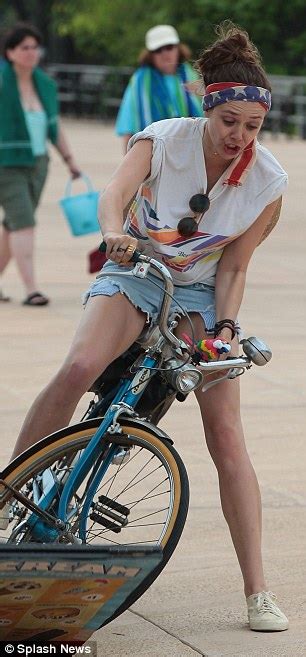 Dakota Fanning And Elizabeth Olsen Cycle Around Coney Island In