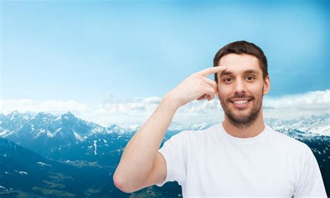 Smiling Young Handsome Man Pointing To Forehead Stock Image Image Of