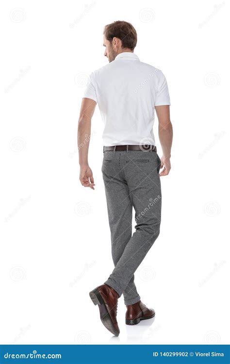 Back View Of A Walking Casual Man Looking To Side Stock Photo Image