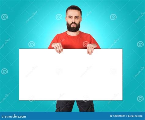Cheerful Man Showing Big Board Of Your Advertisement Stock Image