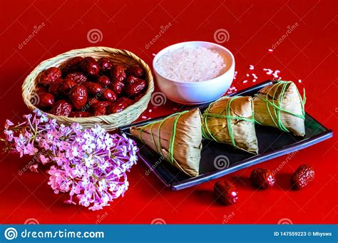 It is a rice dumpling made out of sticky or glutinous rice, wrapped in bamboo leaves to form a pyramid shape that is tied with plant stems. Dragon Boat Festival Traditional Food Zongzi Stock Image ...