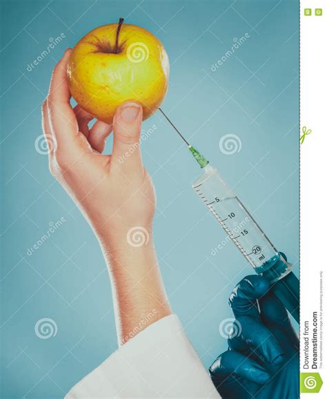 Scientist Doctor Injecting Apple Gm Food Stock Image