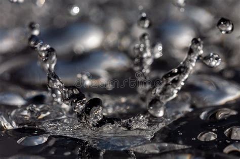 Water Drops Hitting Against A Black Surface Stock Image Image Of Crown Drops 165602615