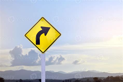 Traffic Warning Sign On Pole Right Curve Means The Way Ahead Is A