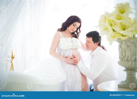 Husband Hugging The Tummy Of A Pregnant Wife With Tenderness And Care Stock Image Image Of