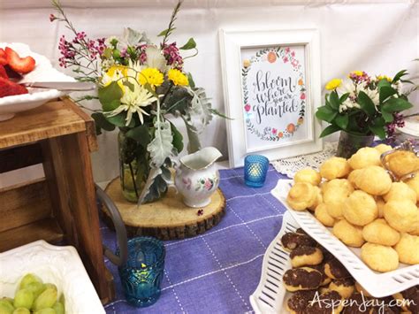 Attach recyclables to an old coat hanger with a sign to create construction birthday party decoration. Relief Society Birthday Garden Party - Aspen Jay