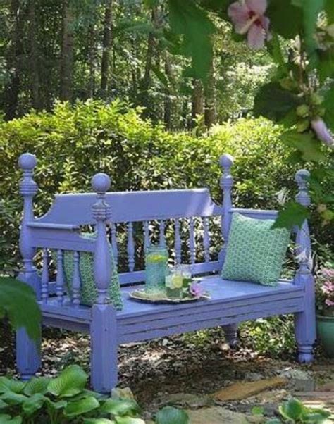 A Blue Bench Sitting In The Middle Of A Garden