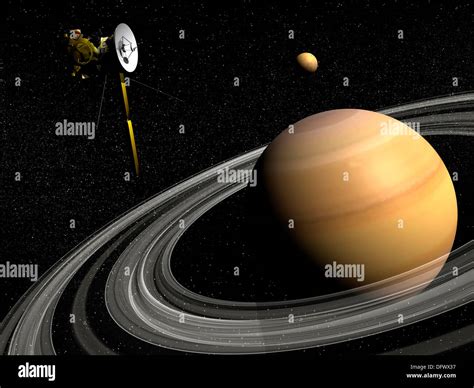 Cassini Spacecraft Orbiting Saturn And And Its Moon Titan Stock Photo