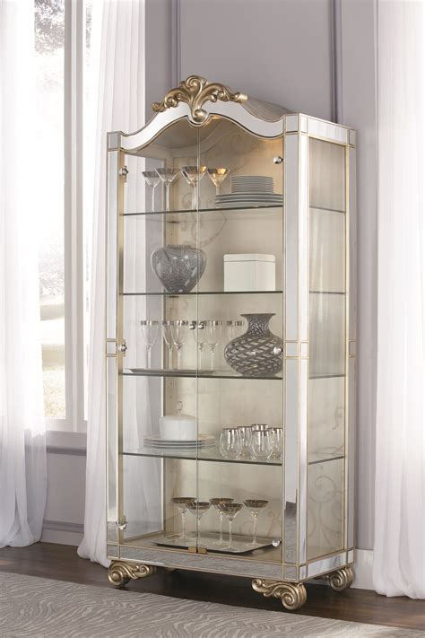 Influenced by furniture craftsmen, and the creative design of nature our inspiration comes from an everchanging range of materials, design elements, and colors. Jessica McClintock Collection - CHINA CABINET # ...