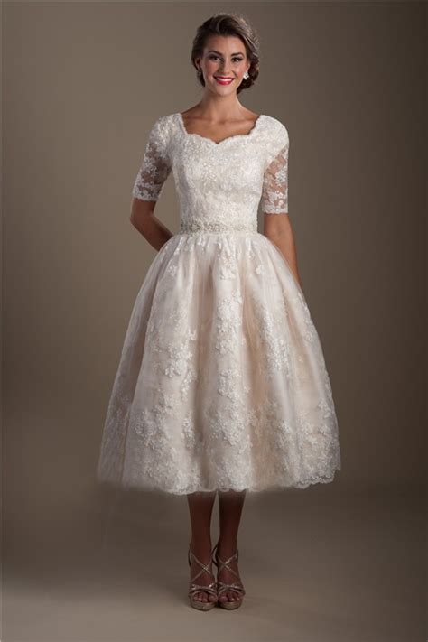 An elegant sheath maternity wedding dress, crafted of flatteringly draped crepe and finished with 3/4 lace sleeves and an attached beaded sash at the empire waist. Ball Gown Short Sleeve Tea Length Lace Modest Wedding Dress