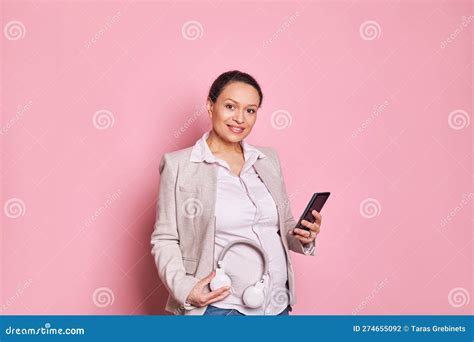 Pregnant Woman With Headphones On Her Belly Puts Some Classical Music