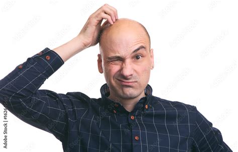 Foto Stock Confused Bald Guy Scratch His Head Adobe Stock