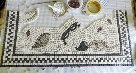 The Table Is Covered With Different Types Of Mosaics