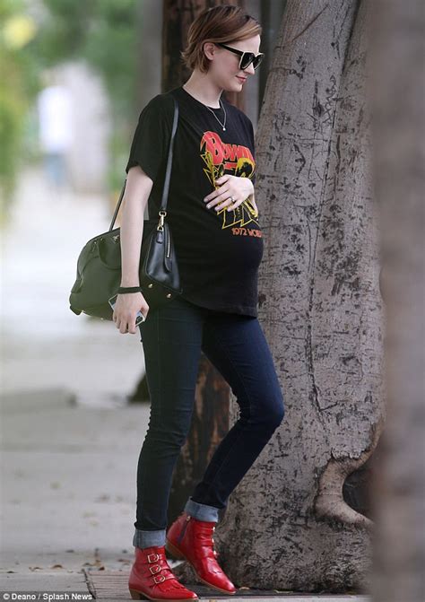 Evan Rachel Wood Sports A Tight T Shirt Jeans And Red Boots As She