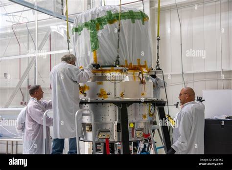 Technicians Perform Work Preparing The Low Earth Orbit Flight Test Of