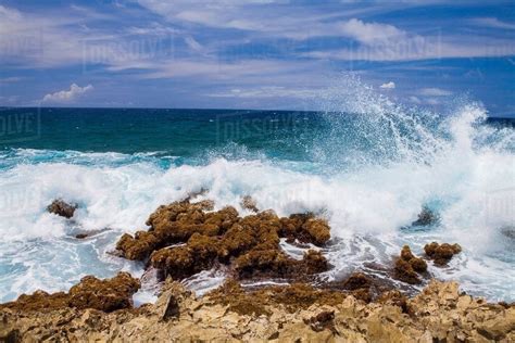 Waves Crashing Over Rocks Palm Beach Oranjestad Aruba Stock Photo