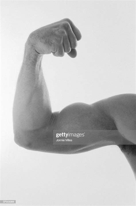 Man Flexing His Muscles High Res Stock Photo Getty Images
