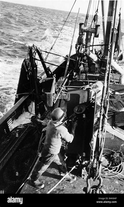 Fisherman Aboard British Trawler Fires An Anti Aircraft Gun At An Enemy