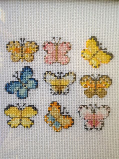 But, i embellished it with a pink crystal charm. Butterfly cross stitch | kateym71 | Flickr