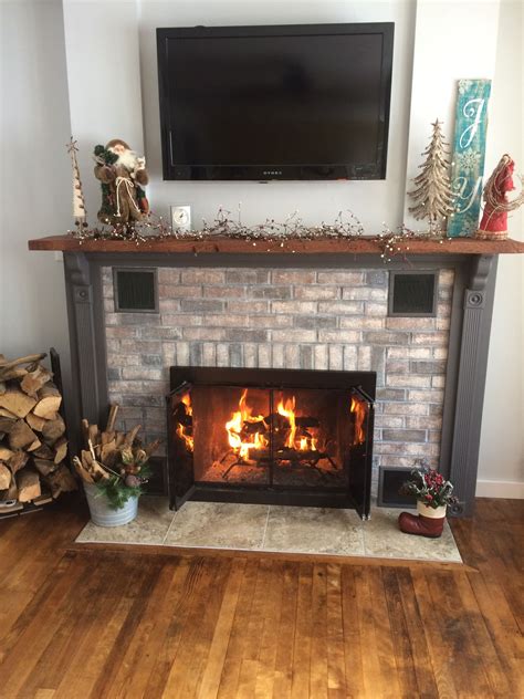 Stained Red Brick Fire Place Then Built Wood Surround And Mantle