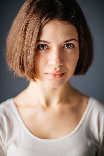 Close Up Portrait Of Young Beautiful Woman With Curious