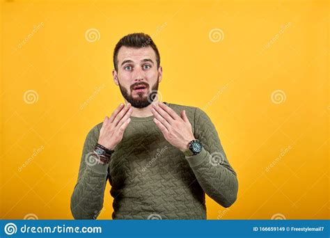 Shocked Handsome Caucasian Man Keeping Hand Near Face Looking Pretty