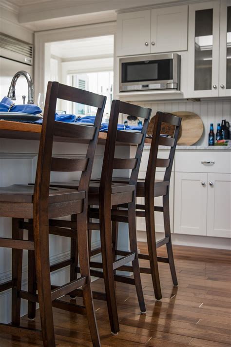 In this kitchen, the table is counter height, with stools that can tuck completely underneath to be fully out of the way. Photo Page | HGTV