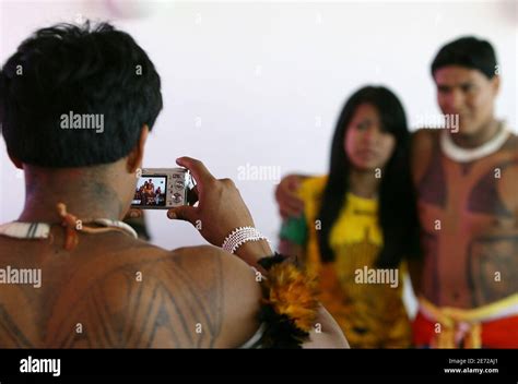 brazilian indians of the yawalapiti tribe in xingu reserve take pictures during a celebration of