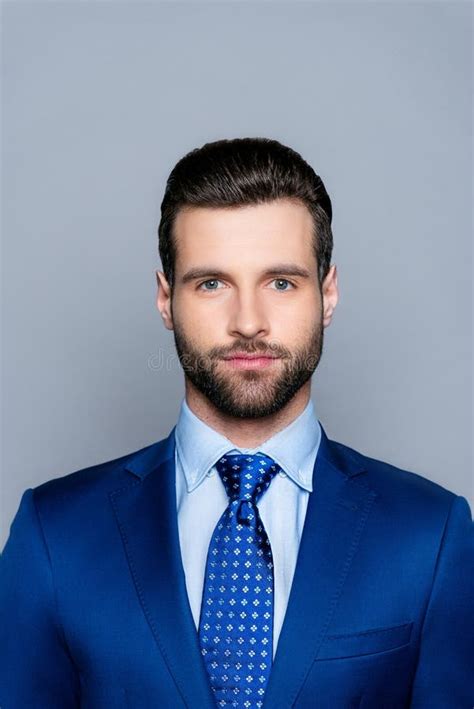 Portrait Of Serious Fashionable Handsome Man Posing In Blue Suit And