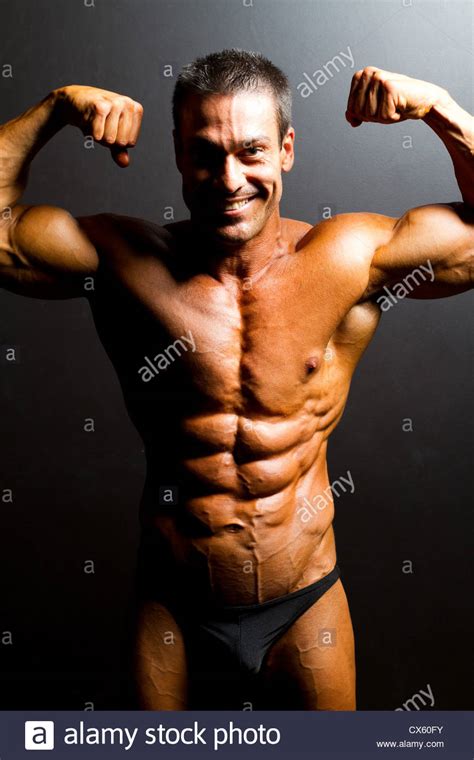 Male Bodybuilder Posing On Black Background Stock Photo Alamy