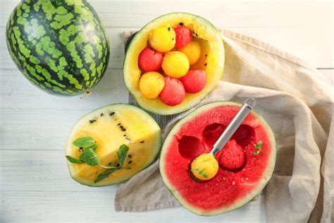 Delicious Cut Watermelons With Balls On White Wooden Table Stock Image
