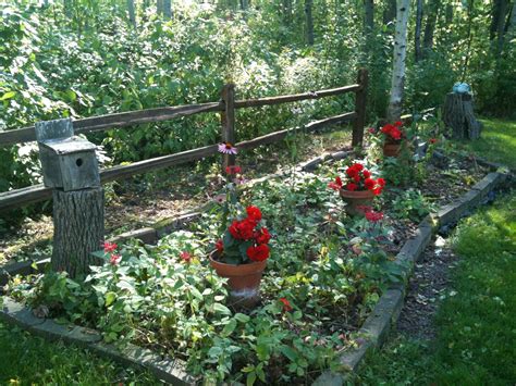 Decorating your yard with flowers and landscaping. Cedar split rail fence garden border | Favorite outdoor ...