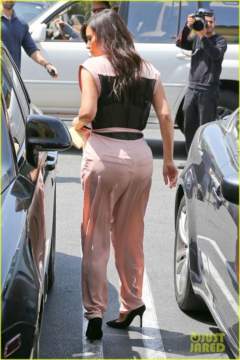 Full Sized Photo Of Kim Kardashian Rocks Pink Jumpsuit With Totally Sheer Back 03 Photo