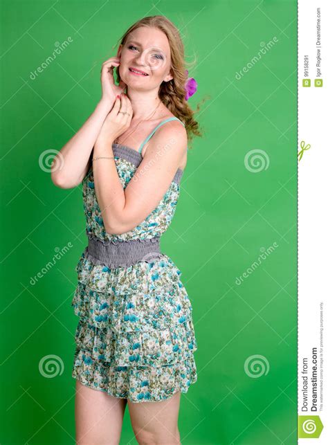 Beautiful Romantic Girl Blonde In Summer Dress With Orchid Flower Stock