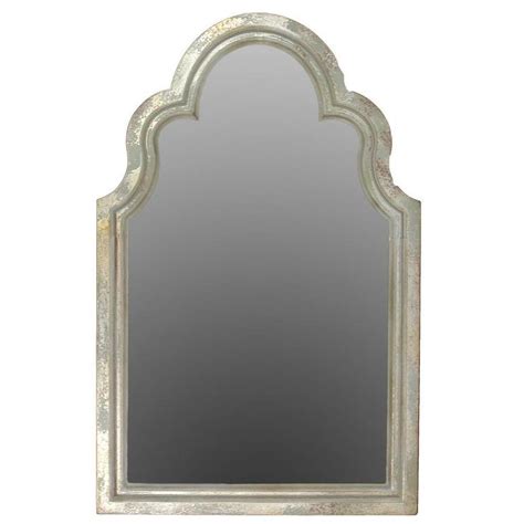 This tall arched silver mirror is a fabulous wall decor piece for lovers of art deco style wall decor and silver home accessories. Silver Finished Weathered Wooden Arched Mirror