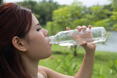Young Woman Drinking Water At Park Stock Photo Image Of Formal