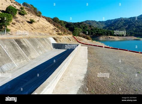 Concrete Dam Spillway Orange Debris Boom On Dry Ground Extremely Low