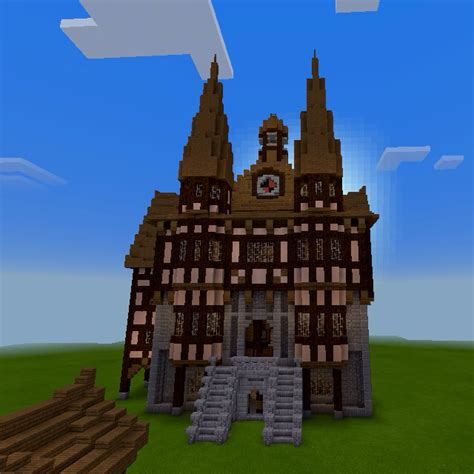A classic and cosy castle with all the medieval trimmings, including flags, torches, hidden rooms, and lots of dusty old tomes. Medieval Germanic Town Hall | Medieval, Minecraft ideas and Minecraft blueprints