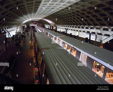 Passengers Board Washington Metrorail Train On Platform For Destination